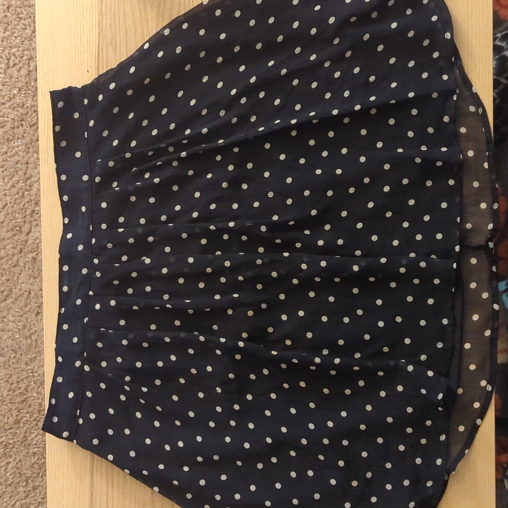 Medium navy blue with white polka dot skirt